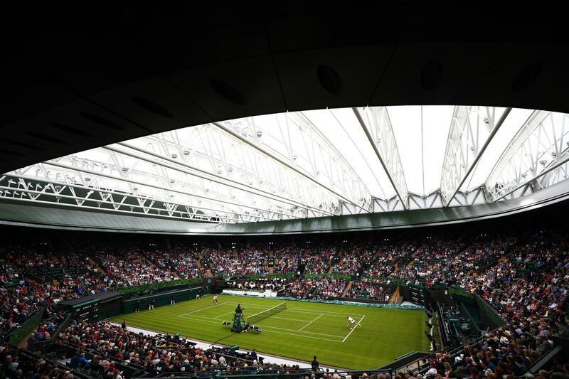 LONDON, ENGLAND - MAY 19:   A general view of No. 1 Court with the new roof closed as Kim Clijsters of Belgium serves to Venus Williams of the United States during the Wimbledon No. 1 Court Celebration in support of the Wimbledon Foundation at All England Lawn Tennis and Croquet Club on May 19, 2019 in London, England. (Photo by Dan Istitene/Getty Images)