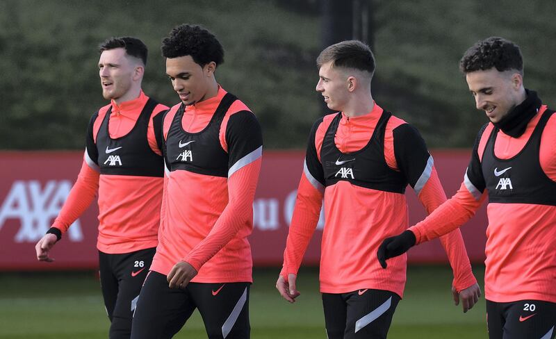 KIRKBY, ENGLAND - APRIL 13: (THE SUN OUT. THE SUN ON SUNDAY OUT) Andy Robertson, Trent Alexander-Arnold, Ben WQoodburn and Diogo Jota of Liverpool during a training session at AXA Training Centre on April 13, 2021 in Kirkby, England. (Photo by John Powell/Liverpool FC via Getty Images)
