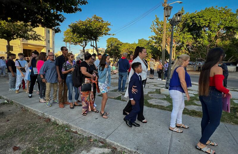 Cubans queue to enter the embassy. AFP