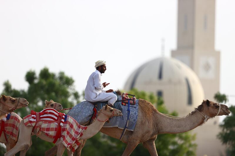 Muslim men, such as this camel handler in Dubai, and women around the world are observing Ramadan, a month-long celebration of self-purification and restraint. Getty Images