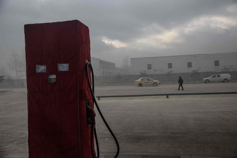 In photo taken on November 20, 2017 cars pass a petrol pump in North Korea's border city of Rason, adjaecent to Russia and China. The North publishes virtually no economic statistics of its own, but according to figures from Chinese Customs, exports to by far its biggest trade partner have plummeted by more than 90 percent. Since then new measures have taken aim at a variety of broad economic sectors, including some of Pyongyang's key foreign currency earners, with exports of coal, iron ore, seafood and other commodities banned, trade in textiles blocked in both directions, and curbs on oil and fuel deliveries.
 - To go with NKorea-weaponry-politics-sanctions-nuclear, Focus by Kang Jin-kyu
 / AFP / Ed JONES / To go with NKorea-weaponry-politics-sanctions-nuclear, Focus by Kang Jin-kyu
