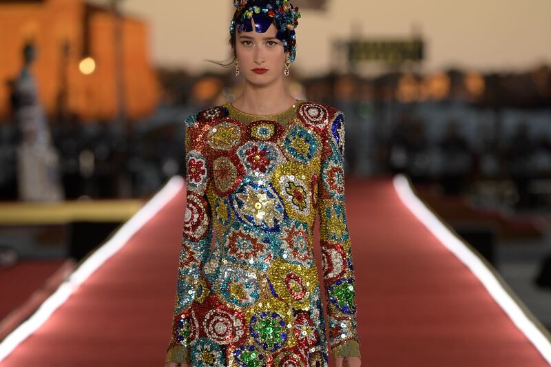 A model presents a look from Dolce & Gabbana's Alta Moda collection in Venice, Italy.