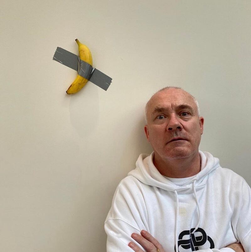 Artist Damien Hirst with a version of Maurizio Cattelan's work recreated by Francesco Bonami. Via @damienhirst / Instagram