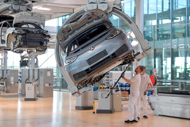 Technicians work in the assembly line of Volkswagen's electric ID. 3 car in Dresden, Germany. Reuters