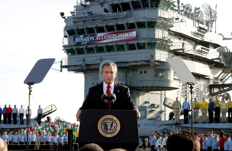 ** FILE ** President Bush declares the end of major combat in Iraq as he speaks aboard the aircraft carrier USS Abraham Lincoln off the California coast, in this May 1, 2003 file photo.  Over and over, President Bush confidently promised to "solve problems, not pass them on to future presidents and future generations." As the clock runs out on his eight-year presidency, a tall stack of troubles remain and Bush's words seem to ring hollow.  (AP Photo/J. Scott Applewhite, File)