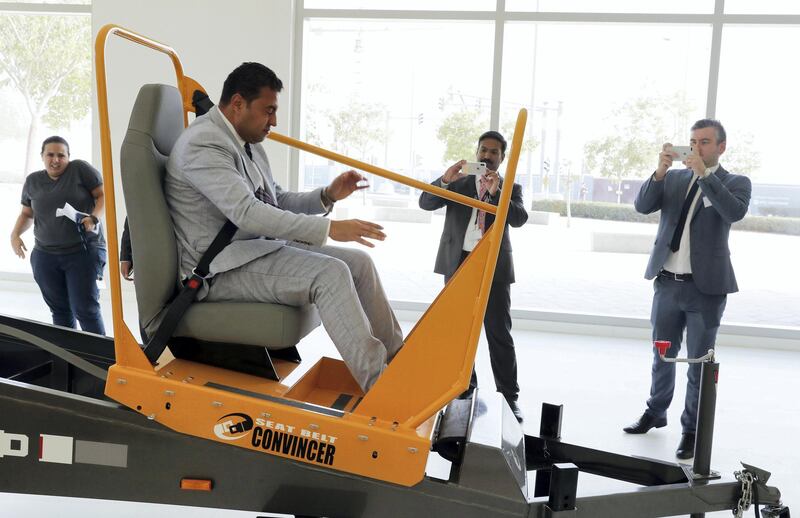 ABU DHABI , UNITED ARAB EMIRATES, September 18 , 2018 :- Ahmed Roshdy , Area General Manager , Facilities Management & Support Services , ADNH Compass taking the live demonstration of seat belt convincer after the Road Safety conference held at the New York University in Abu Dhabi. ( Pawan Singh / The National )  For News. Story by Patrick