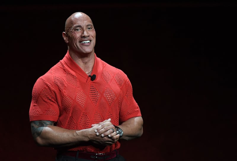 Dwayne Johnson is helping consumers to manage their money through his investment in Acorns. AFP