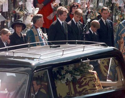 From right: Charles, Prince Harry with his head bowed, William and Earl Spencer. PA