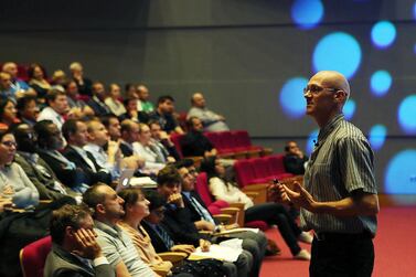 Personal finance author Andrew Hallam giving a talk to investors at Cranleigh School in Abu Dhabi last year. The writer is returning to the UAE later this month following the publication of his latest book - Millionaire Expat: How to Build Wealth Living Overseas.  Satish Kumar / The National