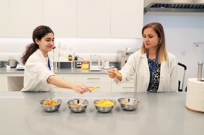 Aseel Taweel (L), laboratory assistant and Sahar Razmkhah, technical laboratory manager at International Flavours & Fragrances. Pawan Singh / The National