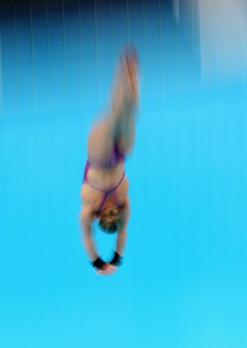 Sarah Barrow of Great Britain dives at the Fina Diving World Series 2014 at the Hamdan Sports Complex. Francois Nel / Getty Images  