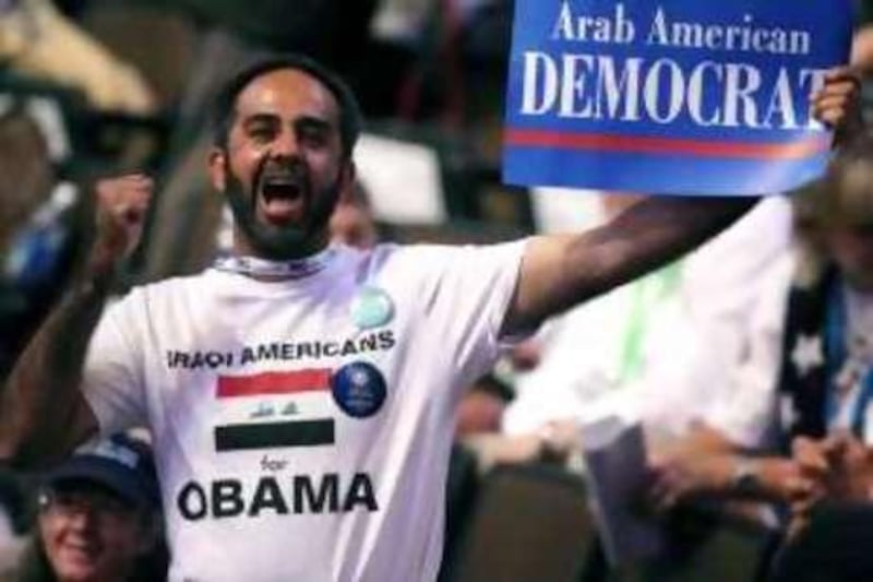 A man holding an "Arab American Democrat" sign cheers during day one of the Democratic National Convention (DNC) at the Pepsi Center August 25, 2008 in Denver, Colorado. The DNC, where U.S. Sen. Barack Obama (D-IL) will be officially nominated as the Democratic candidate for U.S. president, starts today and finishes August 28th.    Justin Sullivan/Getty Images/AFP    == FOR NEWSPAPERS, INTERNET, TELCOS & TELEVISION USE ONLY ==