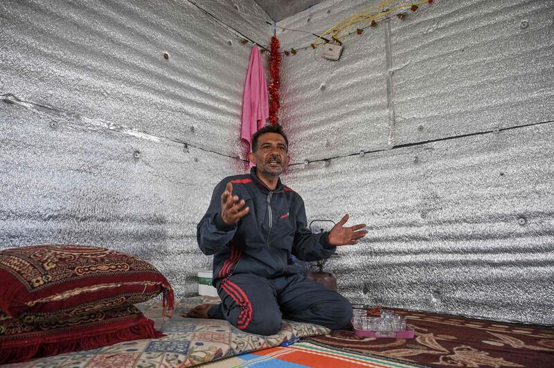 Hamad Al Abdallah in his new home built by the Turkish NGO Humanitarian Relief Foundation (IHH) at Kafr Lusin on the border with Turkey in Syria's north-western province of Idlib. AFP