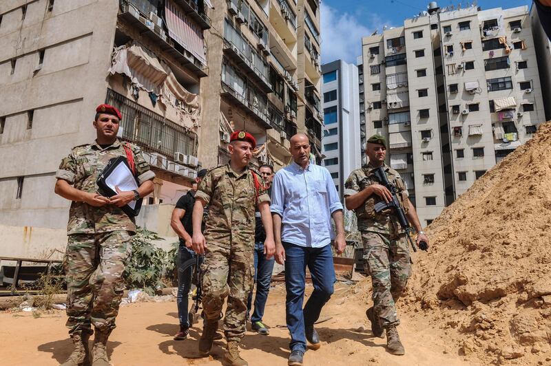 epa07792265 Investigators of Lebanon's military intelligence inspect the site after an alleged attack carried by two Israeli drones, in the southern suburb of Beirut, Lebanon, 25 August 2019. According to the Lebanese Armed Forces (LAF), two Israeli drones violated the Lebanese airspace over the southern suburbs of Beirut, adding that one fell down while the second exploded causing material damage. Hezbollah media office said that the drone caused damage to its media center, hours after Israel launched air strikes in Damascus, Syria.  EPA/NABIL MOUNZER