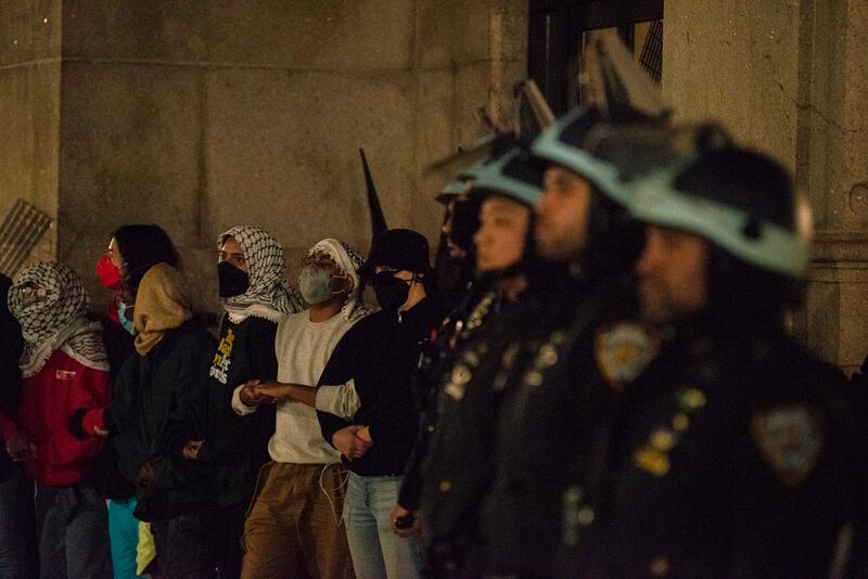The student encampment prepares for a police raid at Columbia University. AP