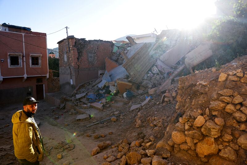 A man stands next to damaged buildings and debris, in the aftermath of a deadly earthquake in Moulay Brahim, Morocco. Reuters