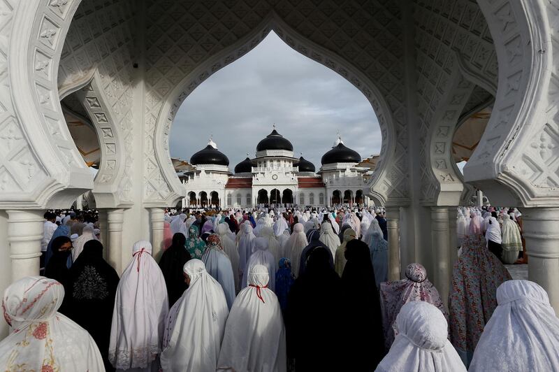 Indonesian women pray during Eid Al Fitr, the festival marking the end of Ramadan, at a mosque in Banda Aceh, Aceh Province, Indonesia. Reuters