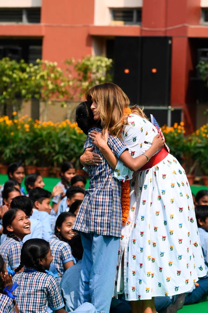 US First Lady Melania Trump hugs a student during her visit at Sarvodaya Co-Ed Senior Secondary School, in New Delhi.  AFP