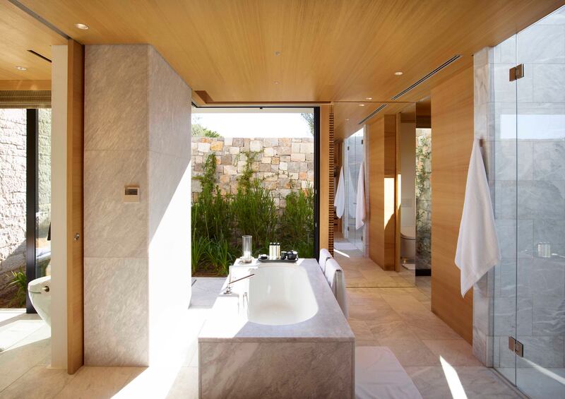 Freestanding bathtubs offer views of the garden