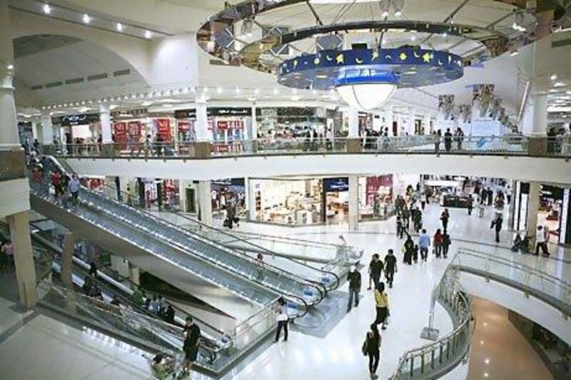 Shoppers walk through the Deira City Centre shopping mall in Dubai. Amy Leang / The National