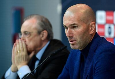 (FILES) In this file photo taken on May 31, 2018 Real Madrid's French coach Zinedine Zidane (R) sits beside president Florentino Perez, during a press conference to announce his resignation in Madrid. Zinedine Zidane resigned as Real Madrid manager because he felt the Spanish club no longer had any faith in him, he wrote in an open letter on May 31, 2021.

 / AFP / PIERRE-PHILIPPE MARCOU

