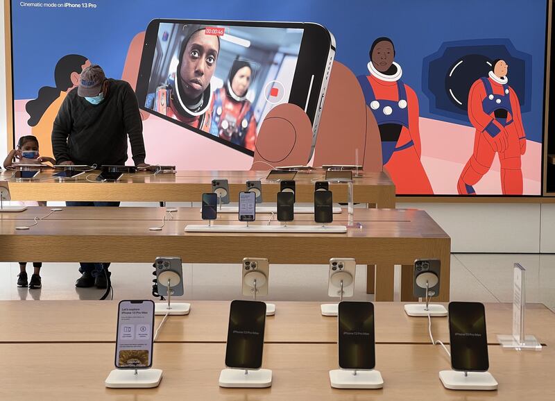 Apple shipped a record 237.9 million iPhones in 2021, which was more than 17 per cent of total global shipments, Counterpoint Research reported. AFP