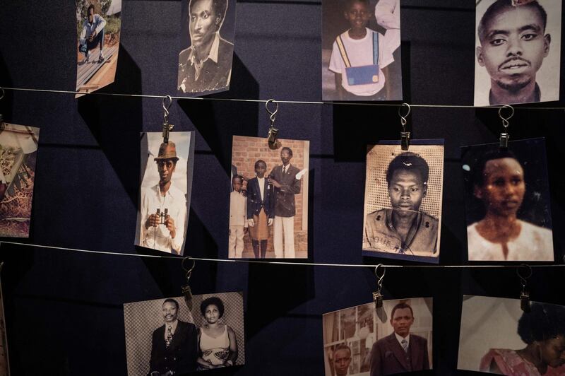 Victims pictures are displayed at the Kigali Genocide Memorial in Kigali, Rwanda, on April 7, 2021. / AFP / Simon Wohlfahrt
