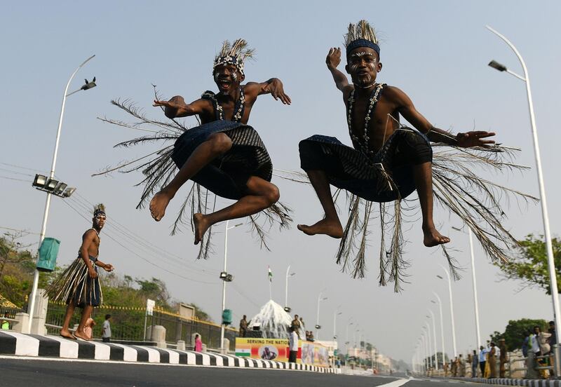 Indian folk artists from Sidi Goma tribal group gestures as they perform during a full dress rehearsal ahead of Republic Day in Chennai. Arun Sankar / AFP