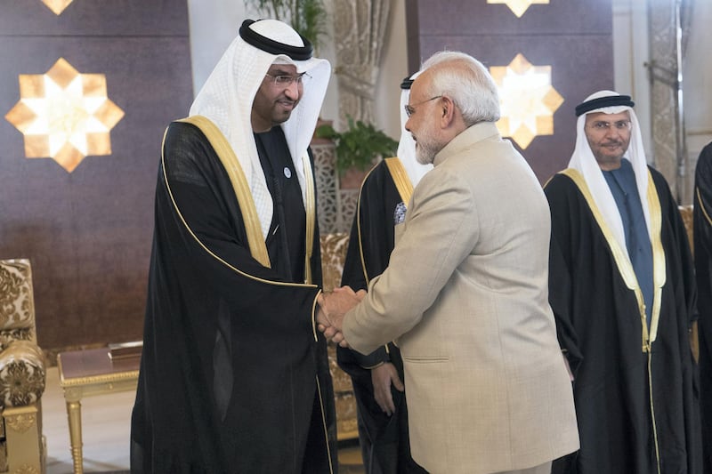 ABU DHABI, UNITED ARAB EMIRATES - February 10, 2018: HE Dr Sultan Ahmed Al Jaber, UAE Minister of State, Chairman of Masdar and CEO of ADNOC Group (L), receives HE Narendra Modi Prime Minister of India (C), at the Presidential Airport. Seen with HE Dr Anwar bin Mohamed Gargash, UAE Minister of State for Foreign Affairs (back R). 

( Rashed Al Mansoori / Crown Prince Court - Abu Dhabi  )
---