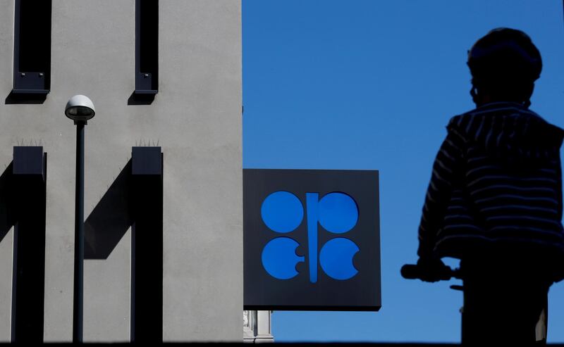 FILE PHOTO: A person passes the logo of the Organization of the Petroleum Exporting Countries (OPEC) in front of OPEC's headquarters in Vienna, Austria April 9, 2020.  REUTERS/Leonhard Foeger/File Photo