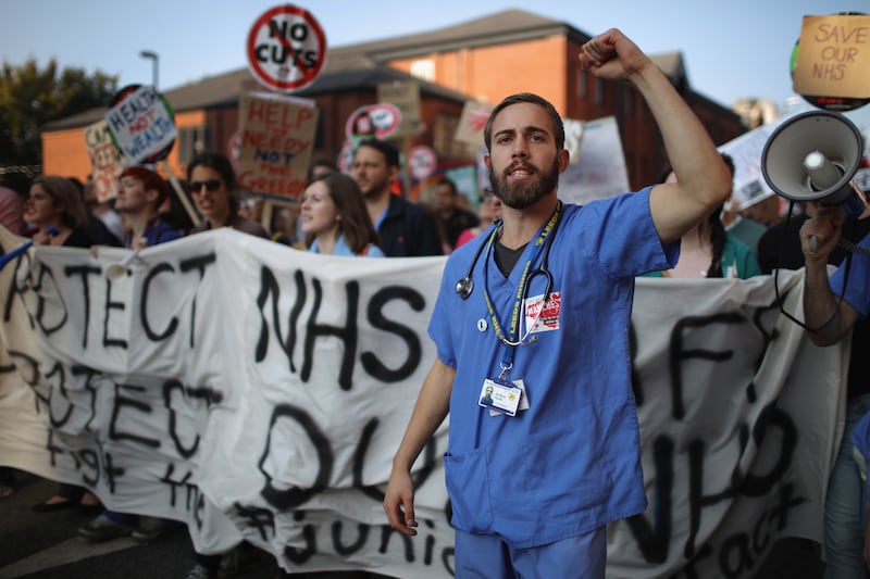 NHS workers take part in an anti-austerity protest during the first day of the 2015 Conservative Party Autumn Conference in Manchester. Getty Images