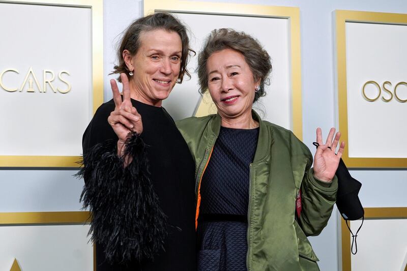 Frances McDormand, Best Actress winner, and Youn Yuh-jung, Best Supporting Actress winner, pose in the press room at the Academy Awards in Los Angeles, California. Reuters