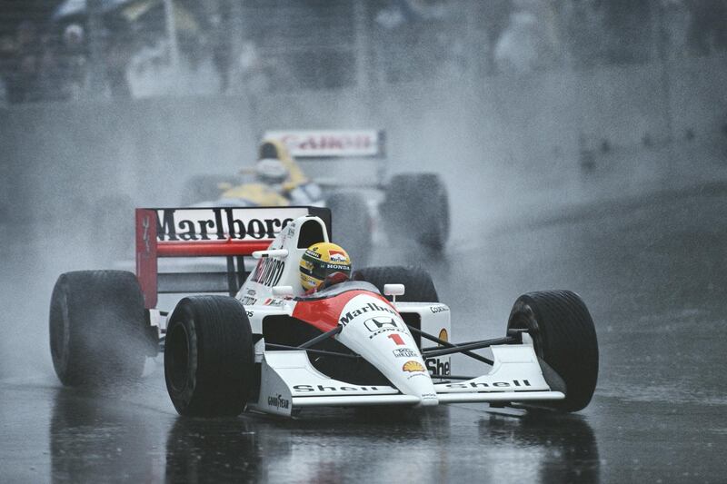 Ayrton Senna of Brazil drives the #1 Honda Marlboro McLaren McLaren MP4-6 ahead of Nigel Mansell in the Canon Williams Renault Williams FW14 in the rain during the Australian Grand Prix on 3 November 1991 at the Adelaide Street Circuit in Adelaide, Australia.  (Photo by Darren Heath/Getty Images)  
