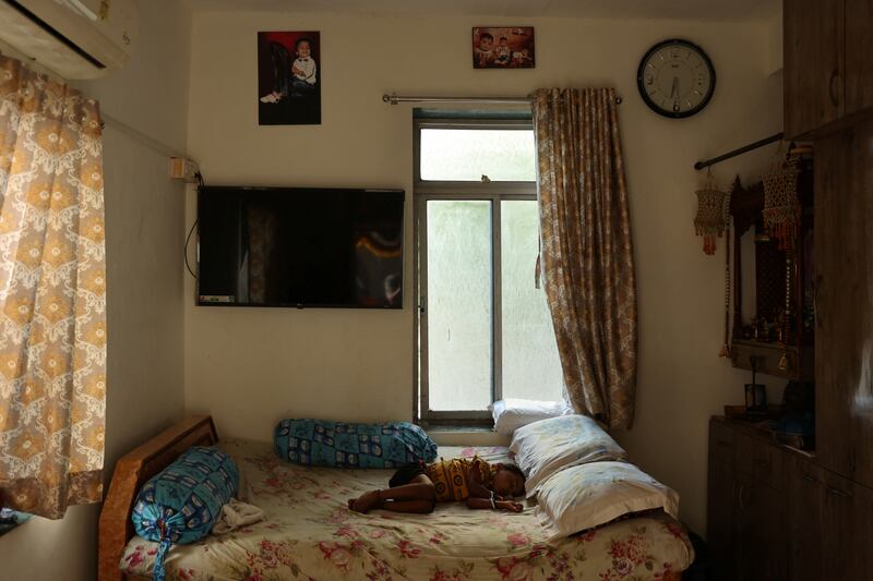 Rahul Makwana's son Aarav, four, sleeps in the new home his family moved into at the Worli dairy quarters building