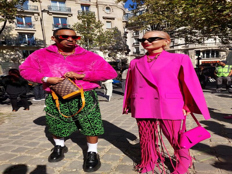 In matching shocking pink outside the Loewe show.