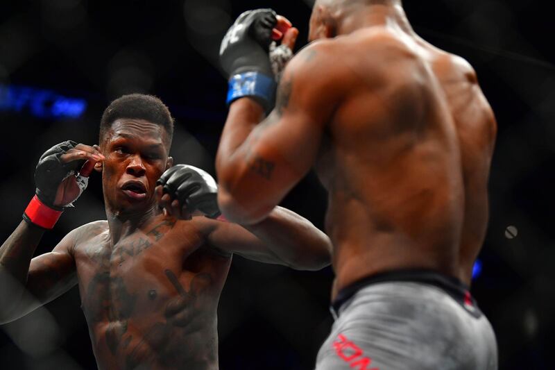 Israel Adesanya and Yoel Romero during their middleweight title fight at UFC 248. Reuters