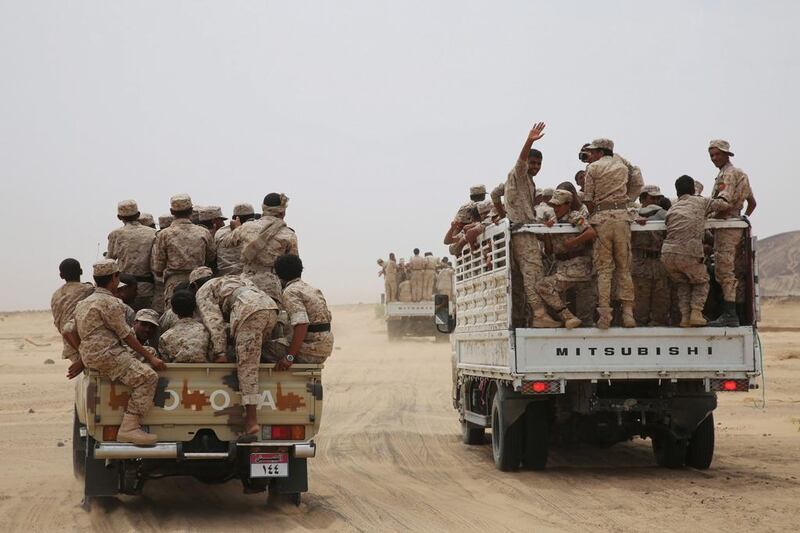 Yemeni army soldiers ride on trucks as they escort Yemen's vice president Ali Muhssien Al Ahmar in the central province of Marib. Reuters