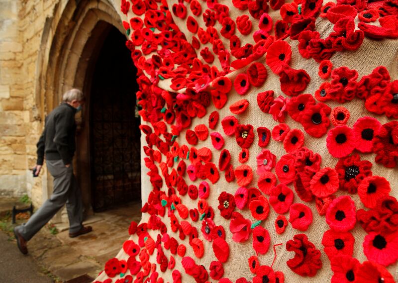 A man walks past a 'River of Poppies' outside St Mary's Bletchley Church in Milton Keynes. Reuters