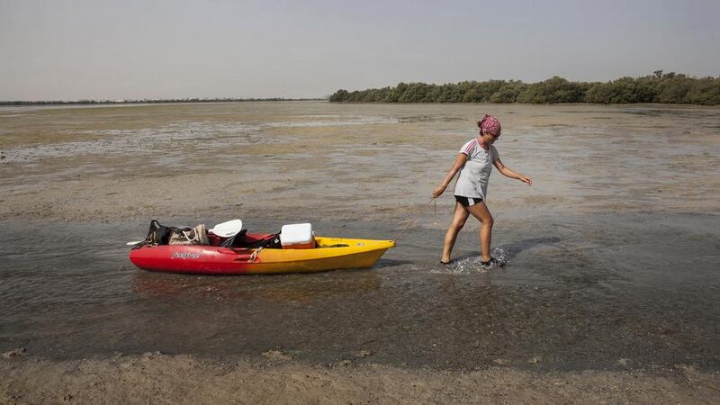 Syrian artist Zahidah Zeytoun Millie paints watercolours in the mangroves of Umm Al Quwain capturing the area’s natural beauty. She says her work also gives her an escape from the bad news from her homeland, where her relatives still live. Antonie Robertson / The National