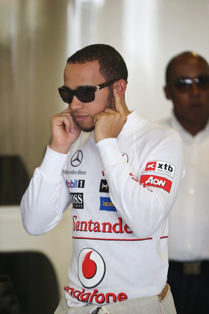 ABU DHABI, UNITED ARAB EMIRATES - NOVEMBER 02:  Lewis Hamilton of Great Britain and McLaren is seen with his father Anthony Hamilton as he prepares to drive during practice for the Abu Dhabi Formula One Grand Prix at the Yas Marina Circuit on November 2, 2012 in Abu Dhabi, United Arab Emirates.  (Photo by Mark Thompson/Getty Images) *** Local Caption ***  155222998.jpg