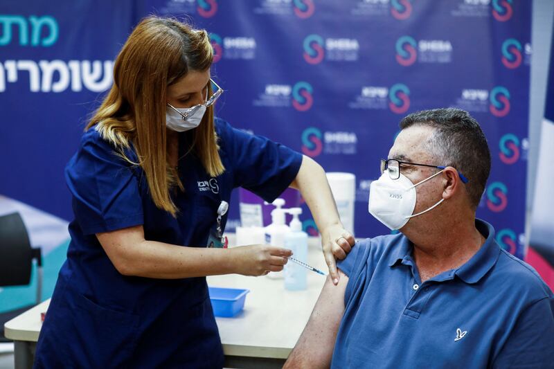 A man receives a fourth dose of the coronavirus disease vaccine after Israel's Health Ministry approved a second booster for the immunocompromised at Sheba Medical Centre in Ramat Gan, Israel. Reuters