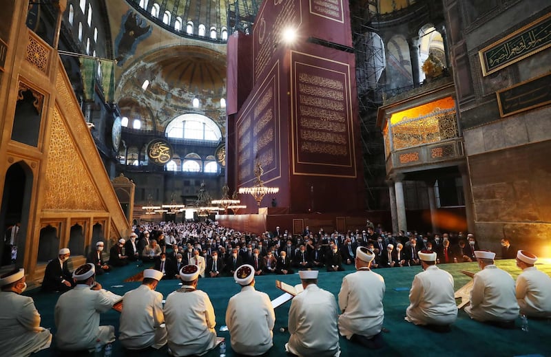 The Hagia Sophia's famed Byzantine frescoes and mosaics were obscured by curtains during the prayers. Turkish Presidential Service / AFP