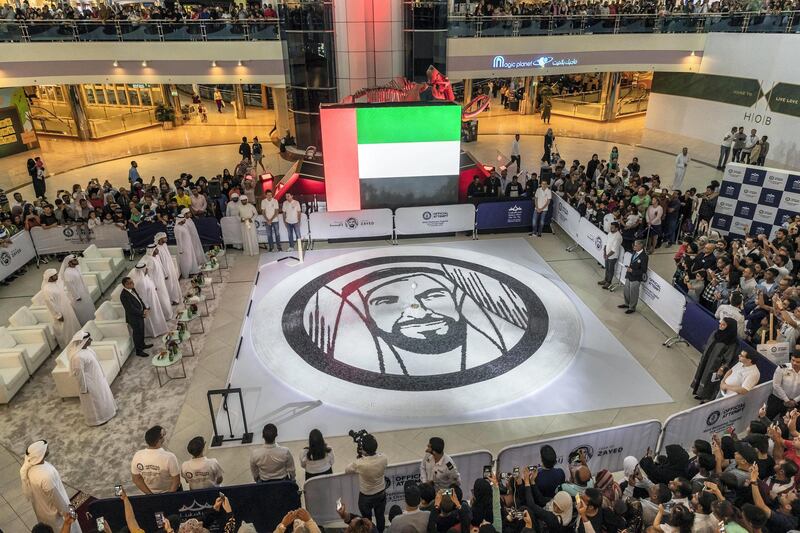 ABU DHABI, UNITED ARAB EMIRATES. 01 DECEMBER 2018. Succesfull World Record attempt for the most Domino’s toppled in a circular form. Shaped in a Year Of Zayed Sheikh Zayed portrait at Marina Mall. (Photo: Antonie Robertson/The National) Journalist: None. Section: National.