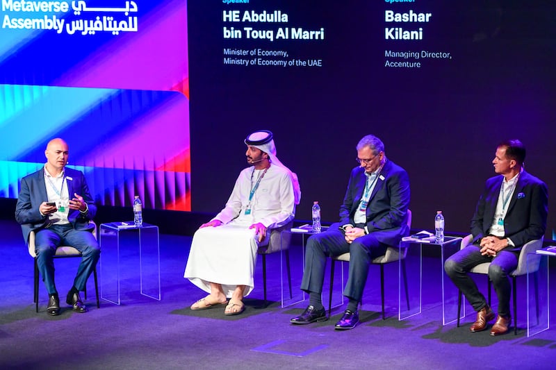 Minister of Economy Abdulla bin Touq, second from left, joins a discussion on 'Metaverse and the Economy' moderated by Karl Tlais, left, founder and strategic advisor of iAdvisory, Accenture managing director Bashar Kilani, second from right, and BCG Digital Ventures managing director and partner Mark Zaleski.