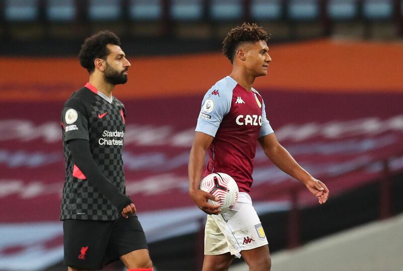 Ollie Watkins with the match ball alongside Liverpool's Mohamed Salah. Reuters