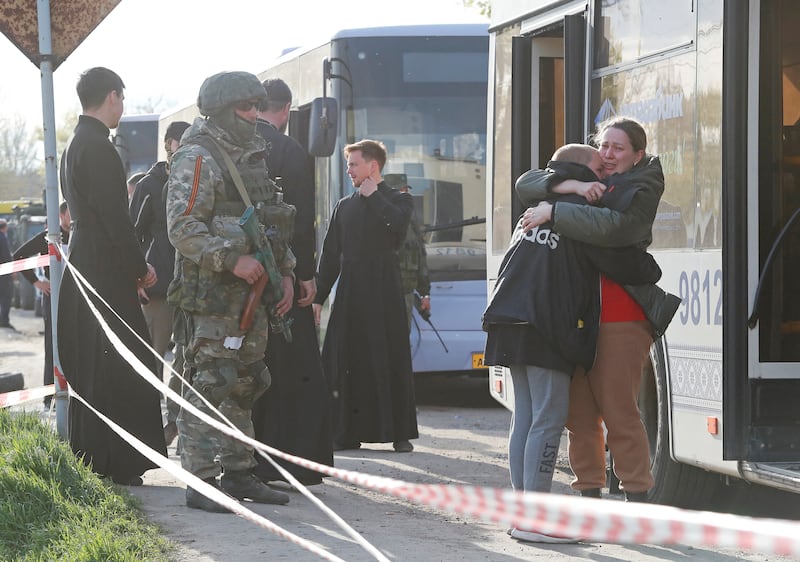 Azovstal steel plant employee Valeria, who was part of an evacuation of Mariupol, hugs her son Matvey, who had earlier left the city with his relatives, as they meet again in Bezimenne, Donetsk. Reuters