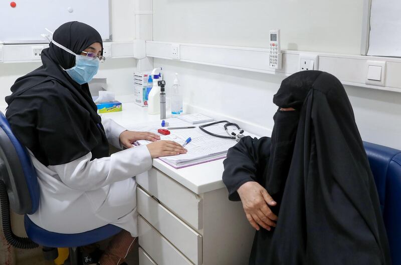 A Saudi nurse talks to a patient after a check-up at a mobile clinic catering for the residents of Ajyad Almasafi district in Makkah.  AFP