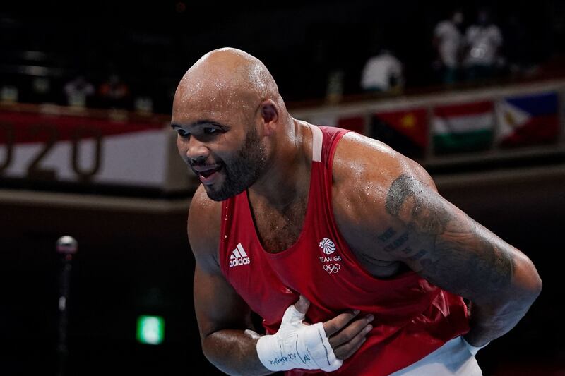 Britain's Frazer Clarke reacts after winning after the disqualification of France's Mourad Aliev.