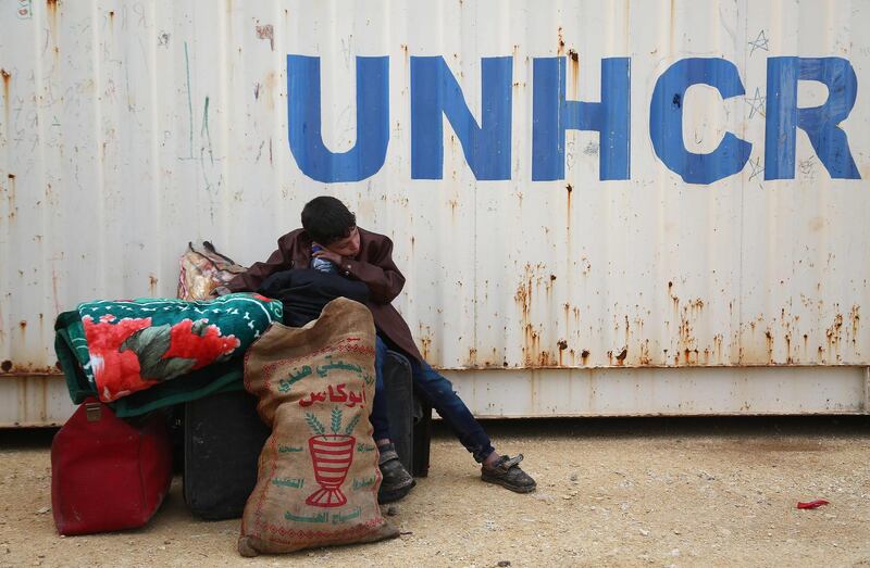 TOPSHOT - CORRECTION - A Syrian boy sits at a camp for displaced Syrians after buses carrying Jaish al-Islam fighters and their families from their former rebel bastion of Douma arrived at the camp in al-Bil, east of the rebel-held town of Azaz in northern Syria, on April 10, 2018. / AFP PHOTO / Nazeer al-Khatib / “The erroneous mention appearing in the metadata of this photo by Nazeer al-Khatib has been modified in AFP systems in the following manner: [camp in al-Bal, east of Azaz -] instead of [camp in Bulbul, west of Azaz]. Please immediately remove the erroneous mention from all your online services and delete it  from your servers. If you have been authorized by AFP to distribute it  to third parties, please ensure that the same actions are carried out by them. Failure to promptly comply with these instructions will entail liability on your part for any continued or post notification usage. Therefore we thank you very much for all your attention and prompt action. We are sorry for the inconvenience this notification may cause and remain at your disposal for any further information you may require.”