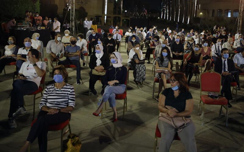 The audience wear face masks and listen to the first concert of Cairo Symphonic Orchestra after coronavirus lockdown at the Opera House Theatre, in Cairo, Egypt.  EPA